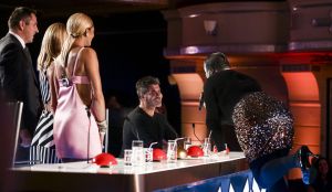 While initially hesitant, Simon appears to get dragged in to Danny Beard's performance