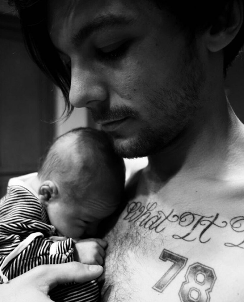 The doting dad is devoted to his baby son