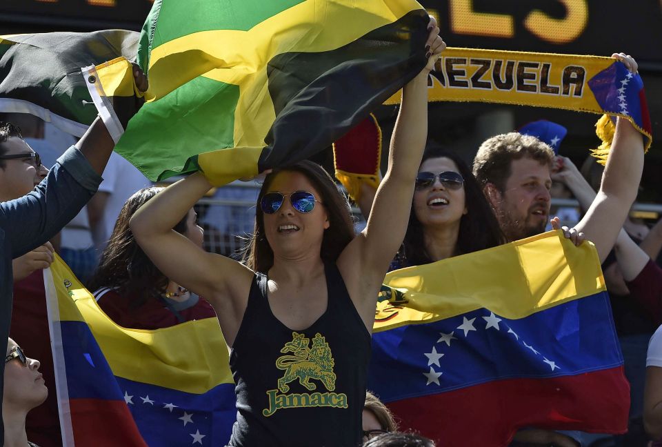 A supporter of Jamaica (foreground) and