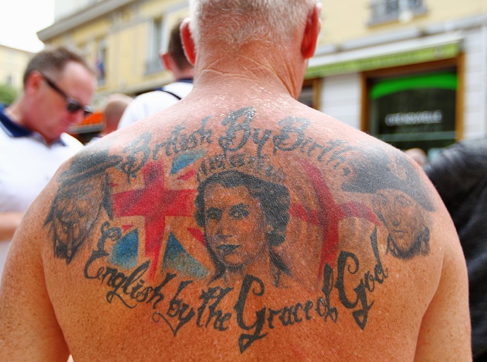 England fan with the Queen Elizabeth tattoo on his shoulders