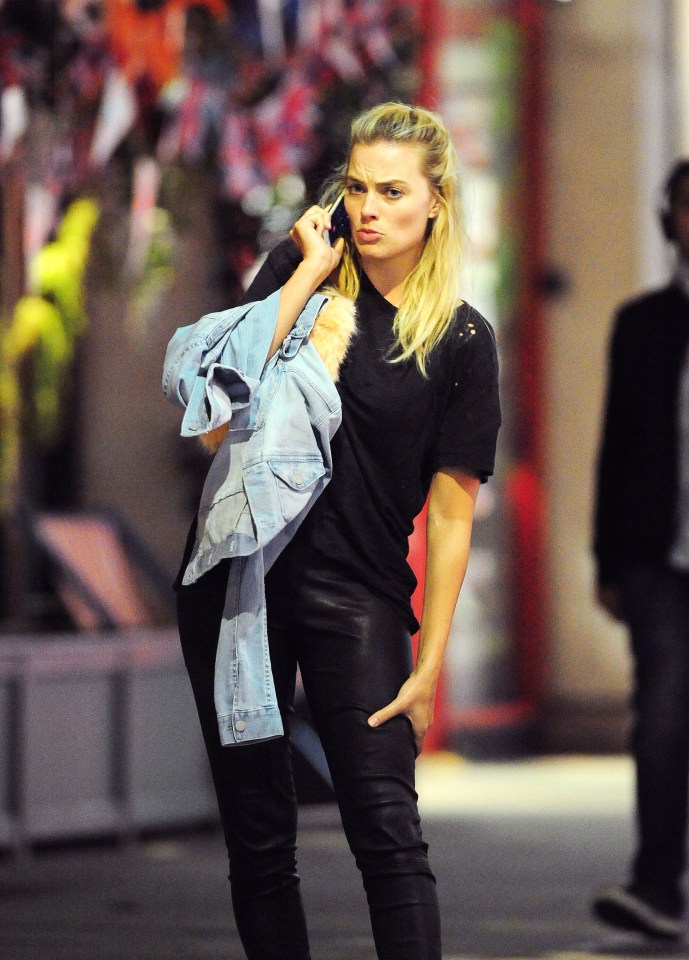 Margot grimaced as she talked on the phone