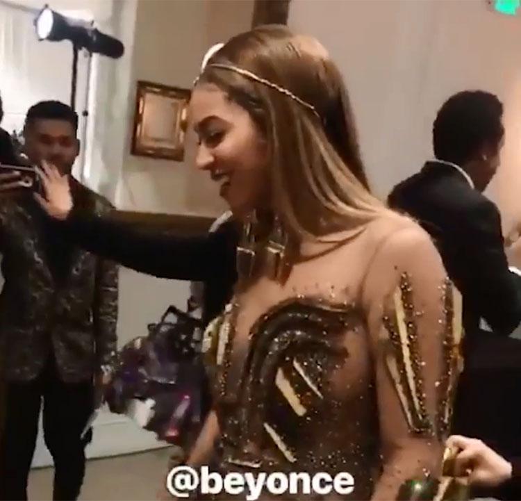  Beyonce opted for a futuristic gold gown with a plunging front