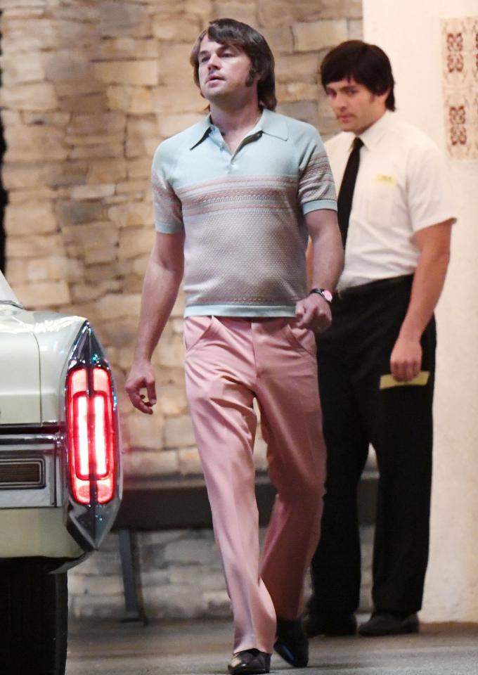  Leo went for a retro look in his tight top and pink trousers