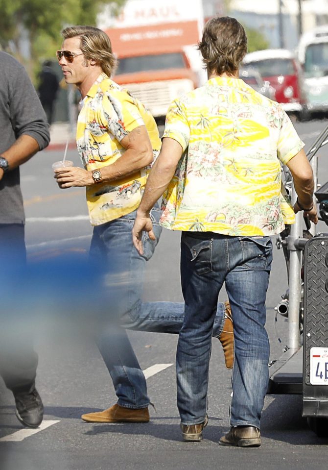 He was later seen grabbing a coffee as his actual stunt double for the film (right) got to work