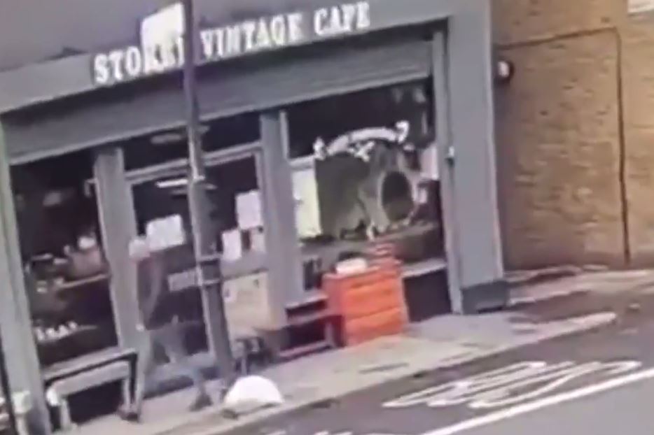 A man walked past the cafe a second before the brick roof blew off