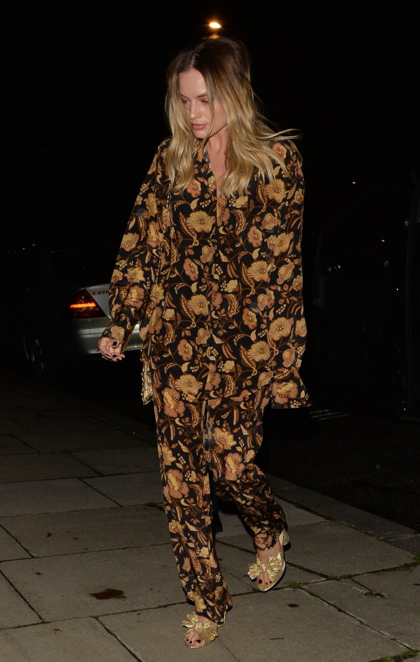  Margot changed out of her burnt orange dress and into a pair of PJs for the after-party