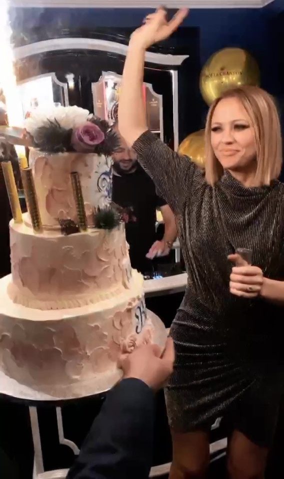  Birthday girl Kimberley Walsh was presented with a towering cake