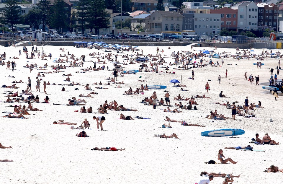  Sunbathers defy social distancing guidelines on Bondi Beach, Australia