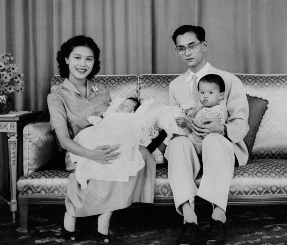 King Bhumibol Adulyadej and Queen Sirikit pose with their children Princess Sirindhorn (front L) and Crown Prince Maha Vajiralongkorn