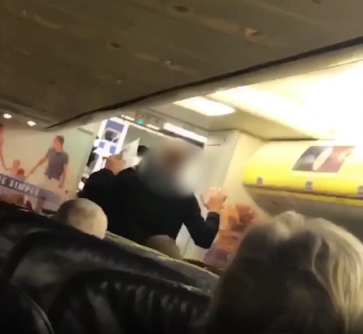 Hendry was filmed being arrested by cops in Manchester shortly after the flight landed