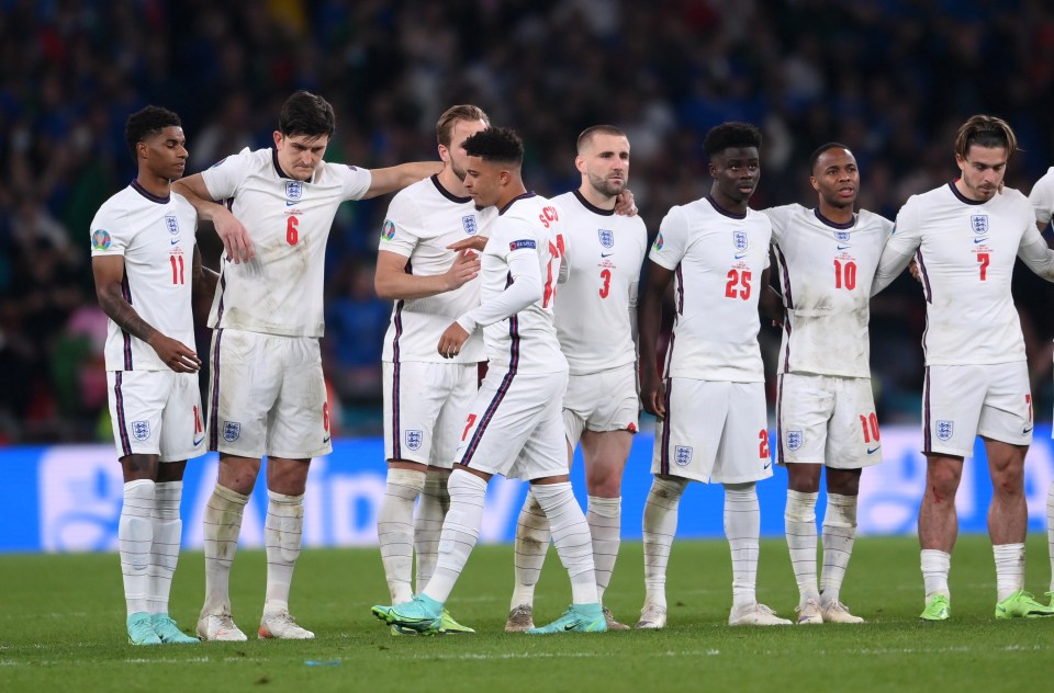 England's Jadon Sancho with teammates during a penalty shootout