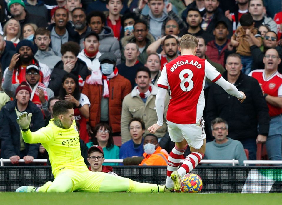 Arsenal star Martin Odegaard burst into Manchester City's penalty area during the first half