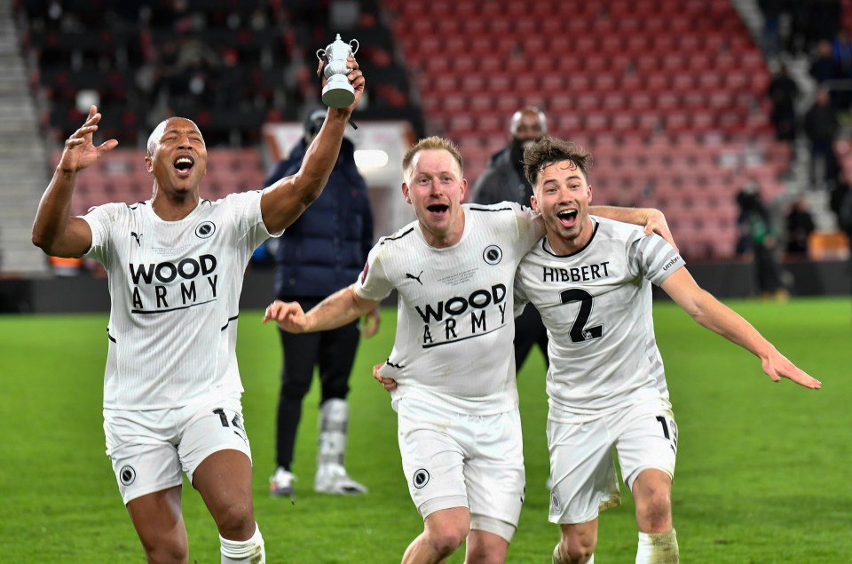 Adrian Clifton (left) celebrates with teammates after knocking AFC Bournemouth out of the FA Cup