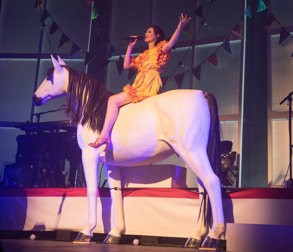 Sophie Ellis-Bextor sported a gold, ruffled dress to straddle a plastic pony at the Cliffs Pavilion on Monday night