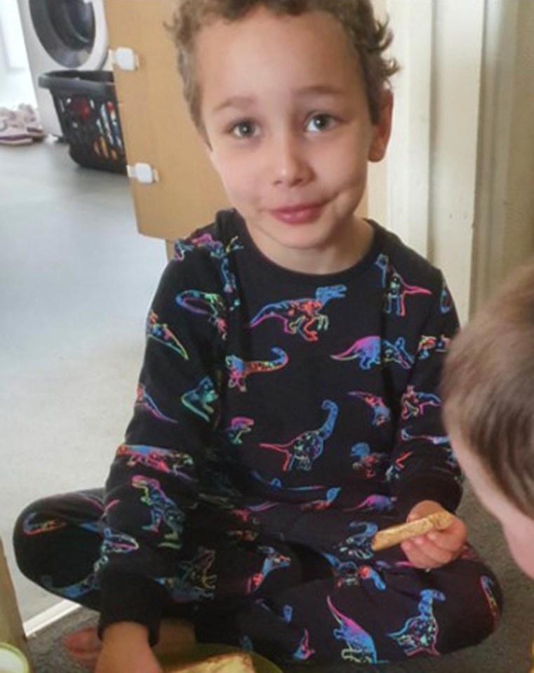 Logan wearing the dinosaur pyjama top that he was wearing when he died