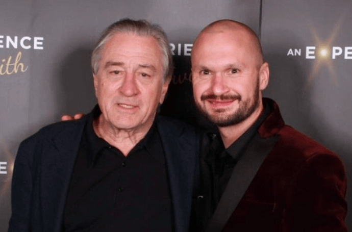 He cosies up with Oscar winner Robert De Niro in this snap