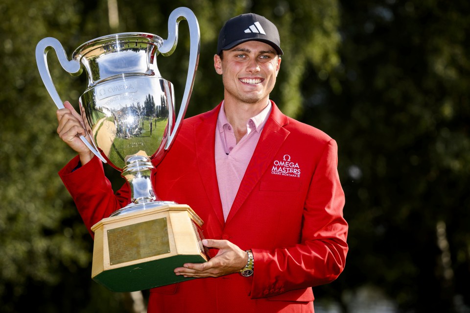 Aberg holding the European Masters trophy