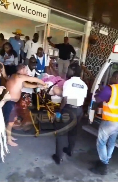 Brit tourist Peter Smith is rushed from the hotel to hospital following the attack