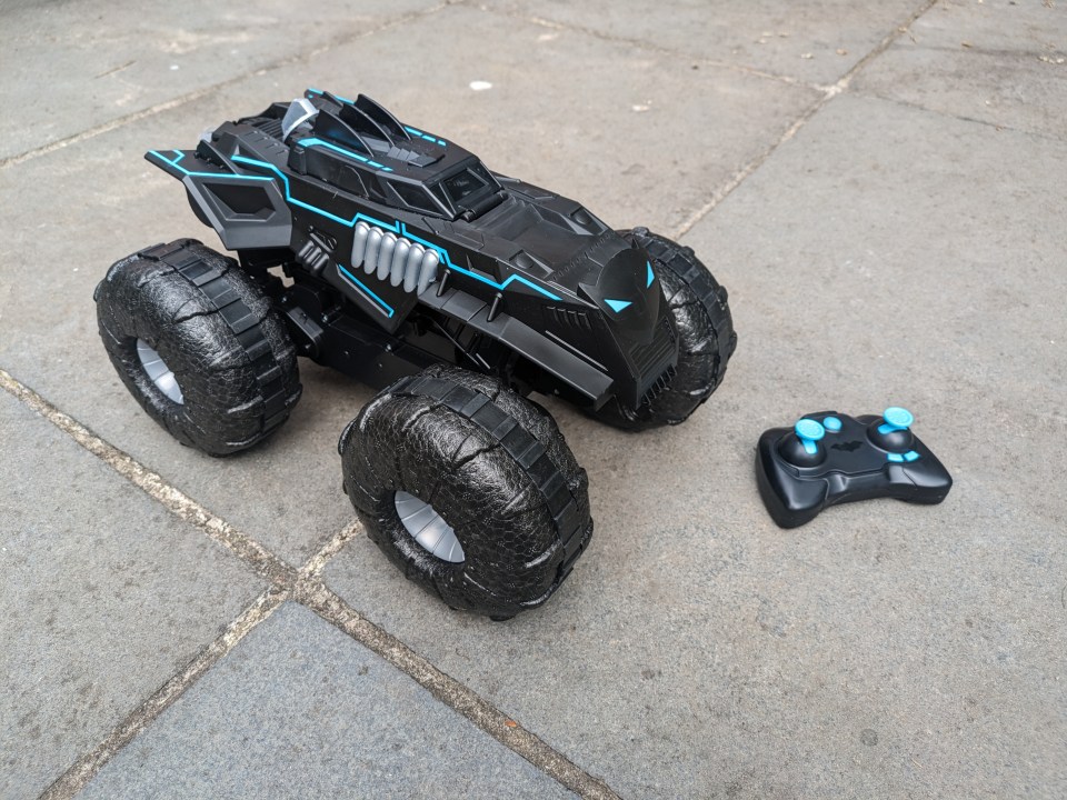 Black Batman-themed remote control monster truck with controller.