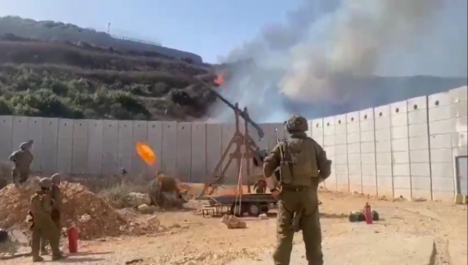 The moment the trebuchet launches a fireball across Israel's border with Lebanon