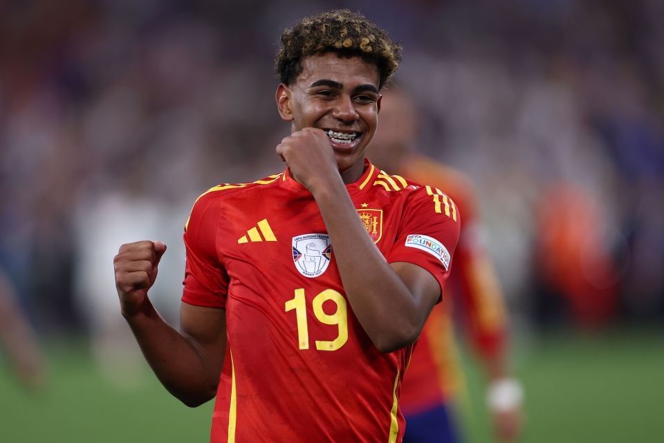 a soccer player wearing a red jersey with the number 19 on it