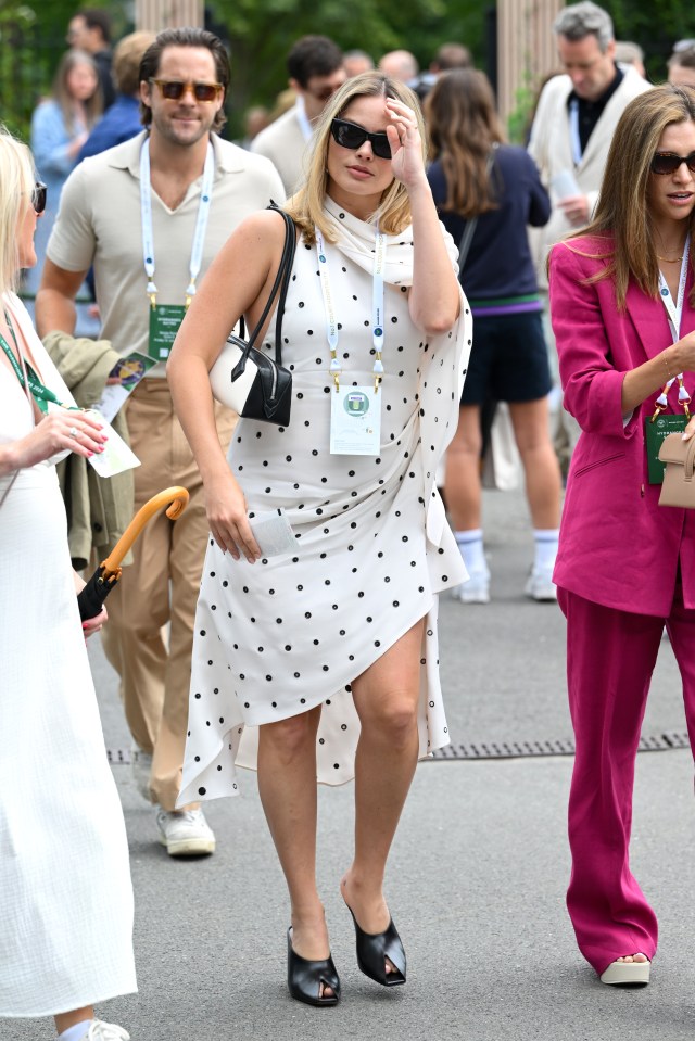 She opted for classic black heeled mules for the outing