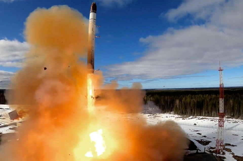 a rocket is being launched with a lot of smoke coming out of it