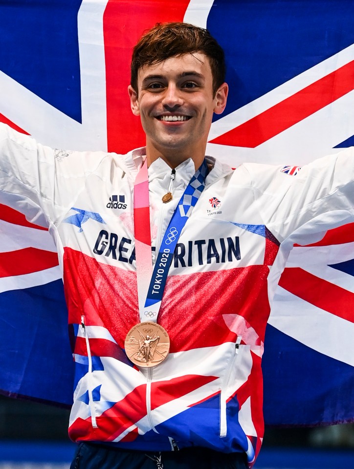 a man wearing a jacket that says great britain on it