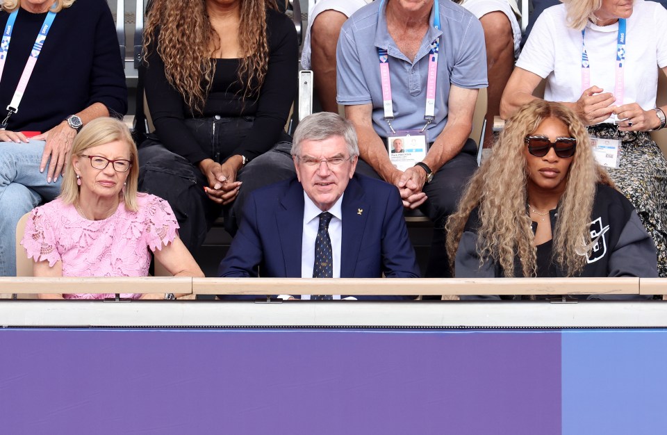 Serena is sat alongside IOC President Thomas Bach and his wife Claudia