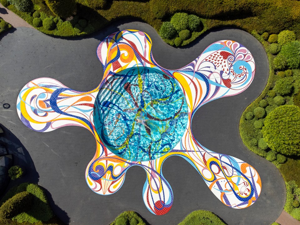 an aerial view of a colorful sculpture in a garden