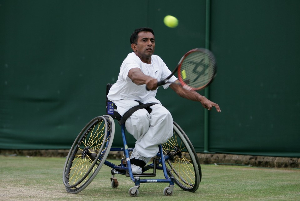 a man in a wheelchair is playing tennis