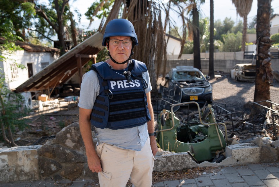 a man wearing a vest that says press on it