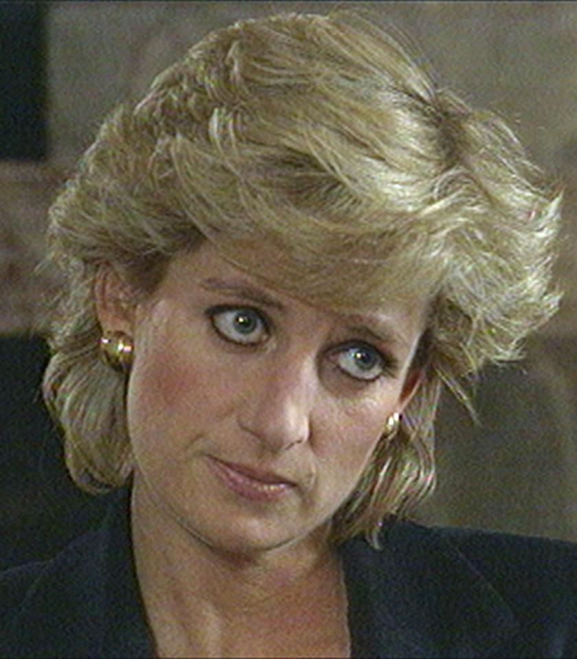 a close up of a woman 's face with a serious look on her face