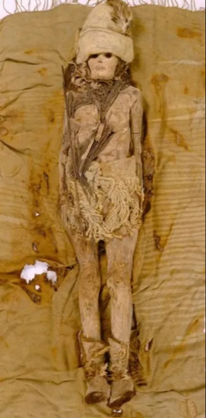 a mummy with a feathered hat and boots