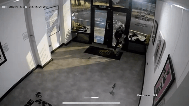 a security camera shows a person entering a building