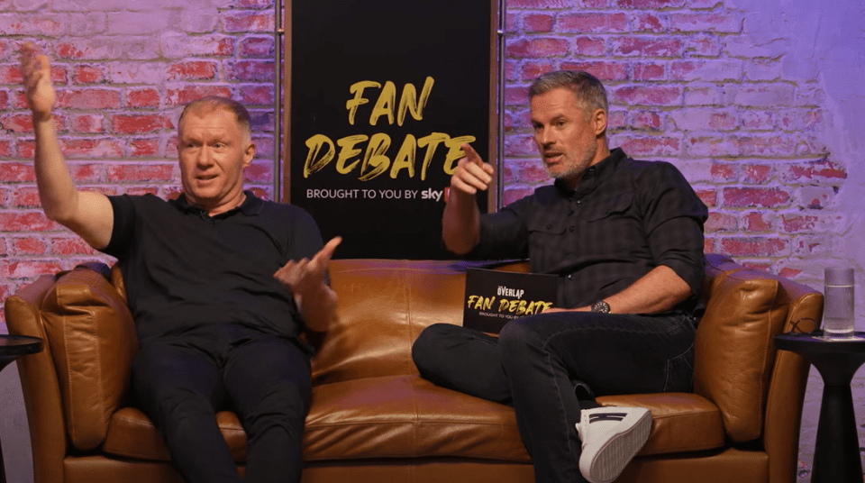 two men sit on a couch in front of a sign that says fan debate
