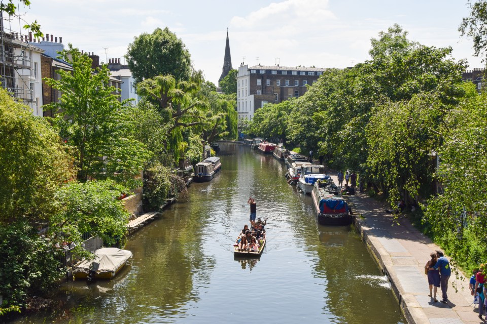 a group of people in a boat on a river