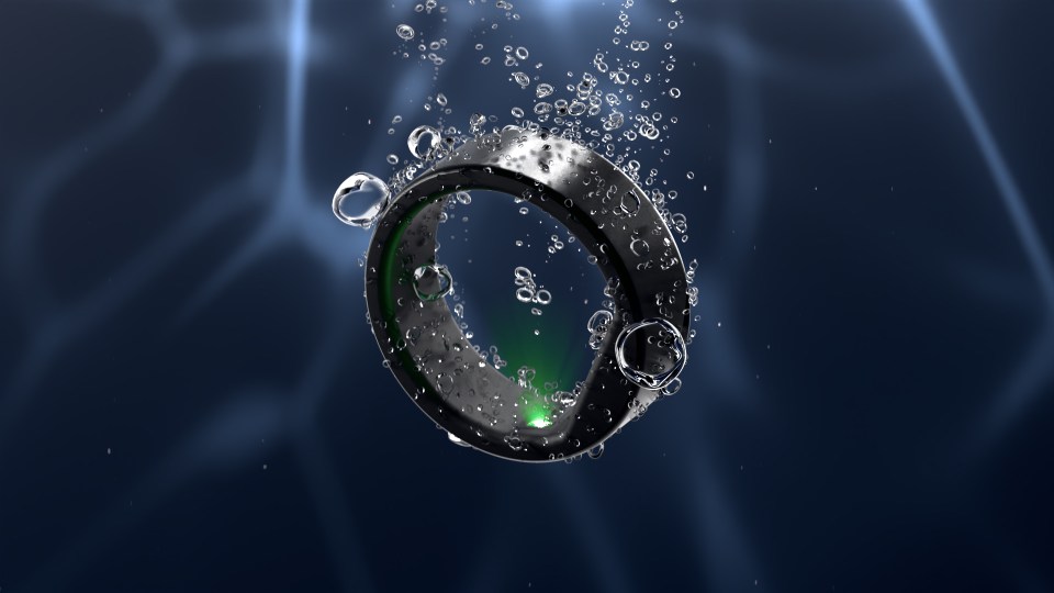 a ring is floating in the water with bubbles around it