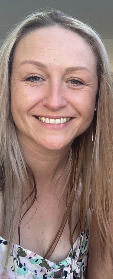 a woman with long blonde hair is smiling for the camera