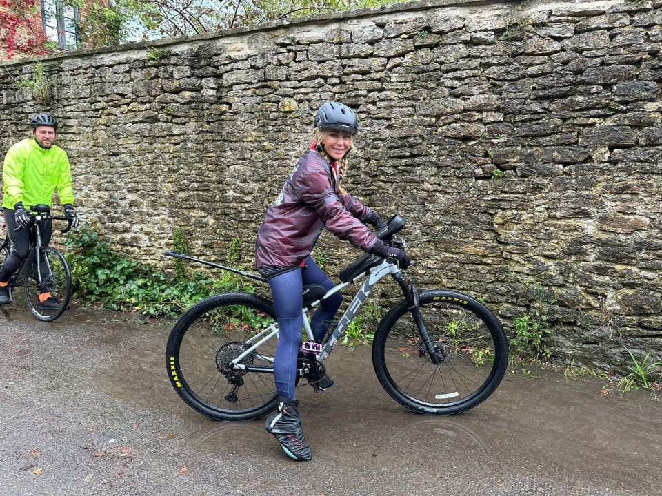 a woman riding a bike with a maxxis tire