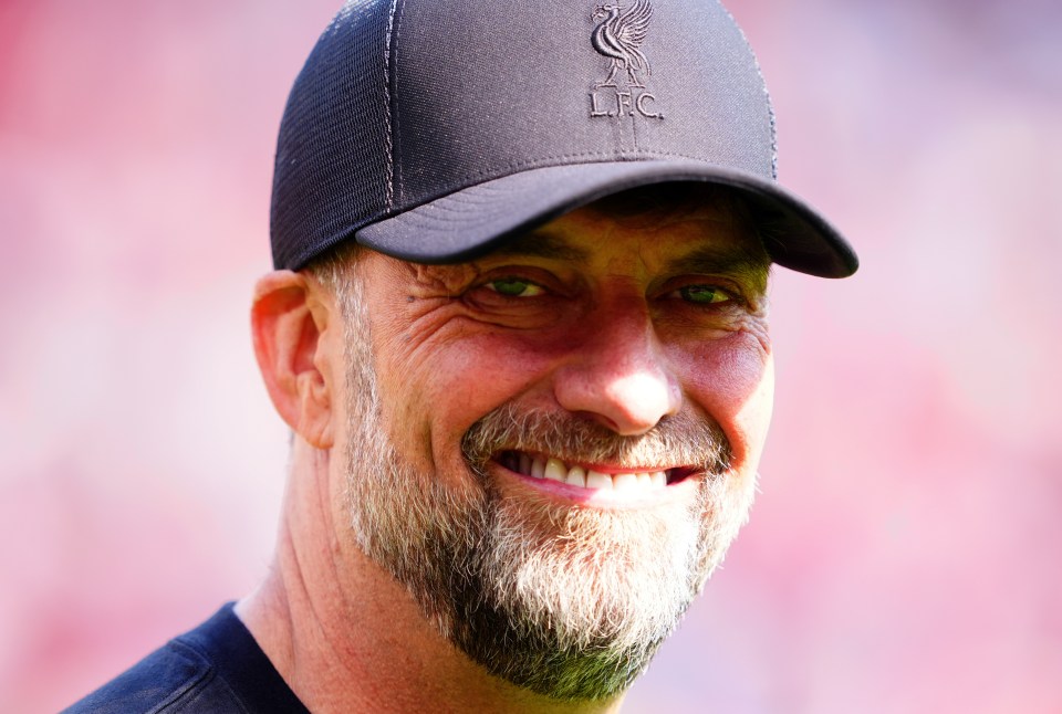 a man with a beard wearing a hat that says lfc
