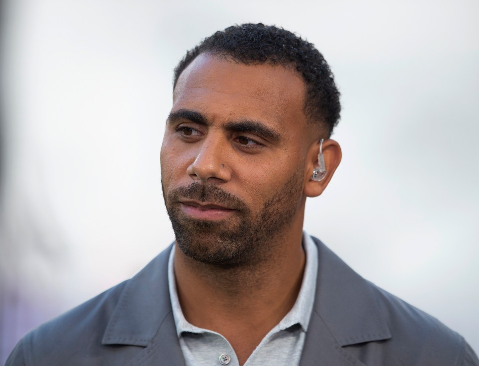 a man with a beard wearing a hearing aid