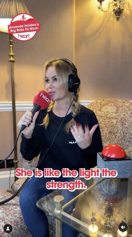 a woman wearing headphones is sitting in front of a microphone and says she is like the light the strength