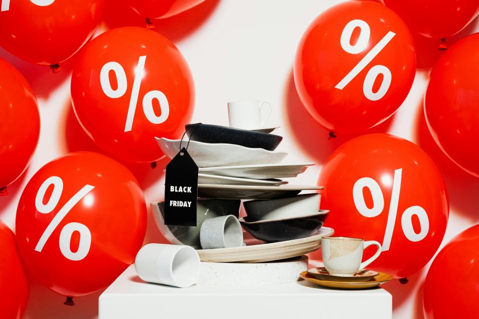 a bunch of red balloons with percentages on them