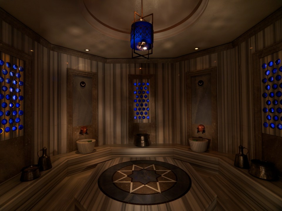 a dark room with a blue lantern hanging from the ceiling
