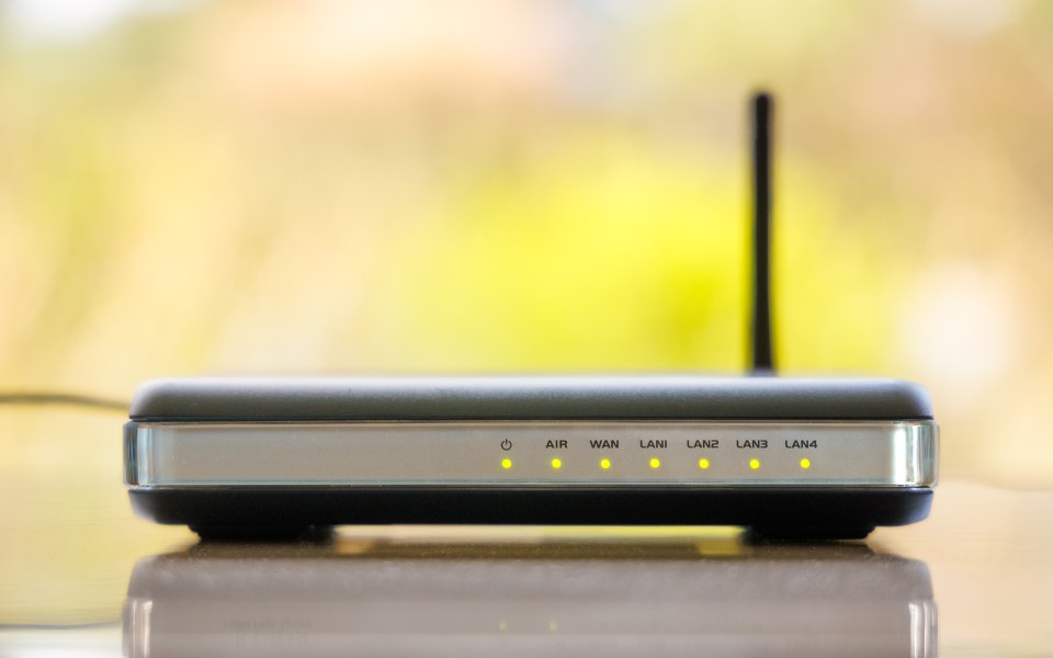 WiFi router with indicator lights illuminated.