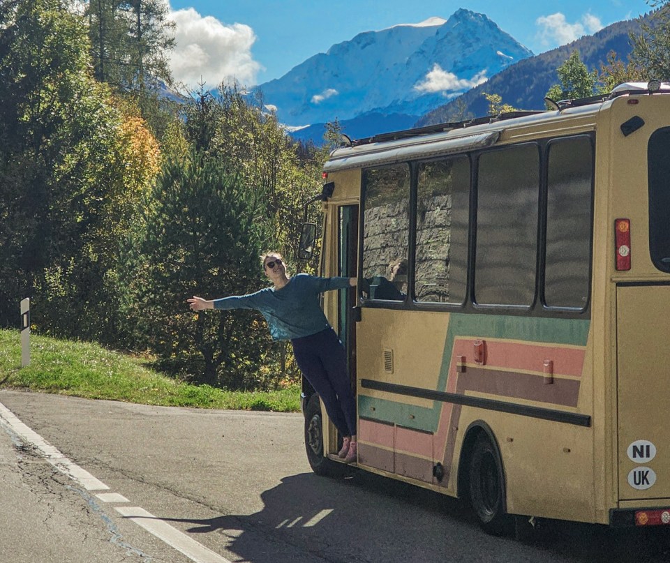 a bus with a sticker on the back that says ni uk