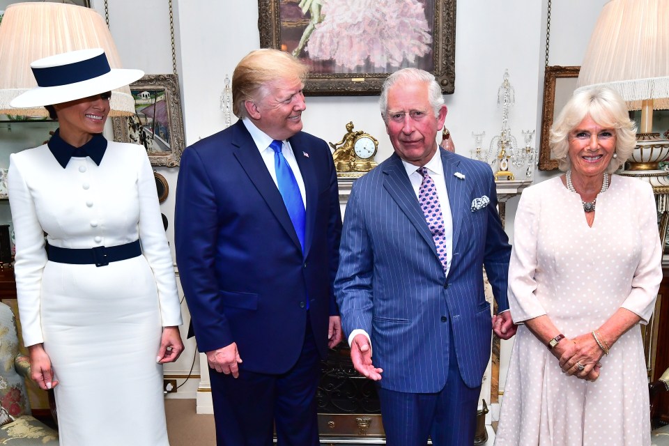 a group of people standing next to each other in a room