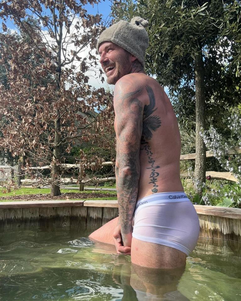 a man in white calvin klein underwear sits in a pool