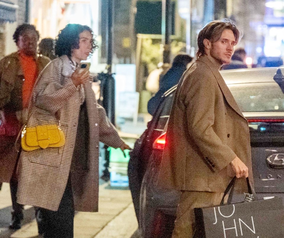 a man carrying a bag that says john on it